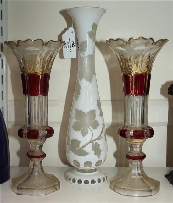 A pair of Bohemian vases and a a similar white overlaid glass, late 19th century, 23.5cm (9.25in.) & 29.5cm (